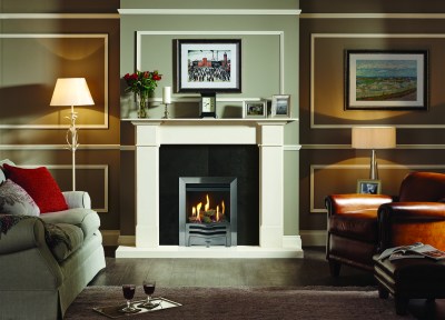 Logic HE conventional flue fire with log-effect and Highlight Polished Wave front. Shown with Claremont limestone mantel